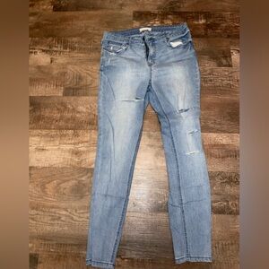 Mid rise stretch distressed jeans